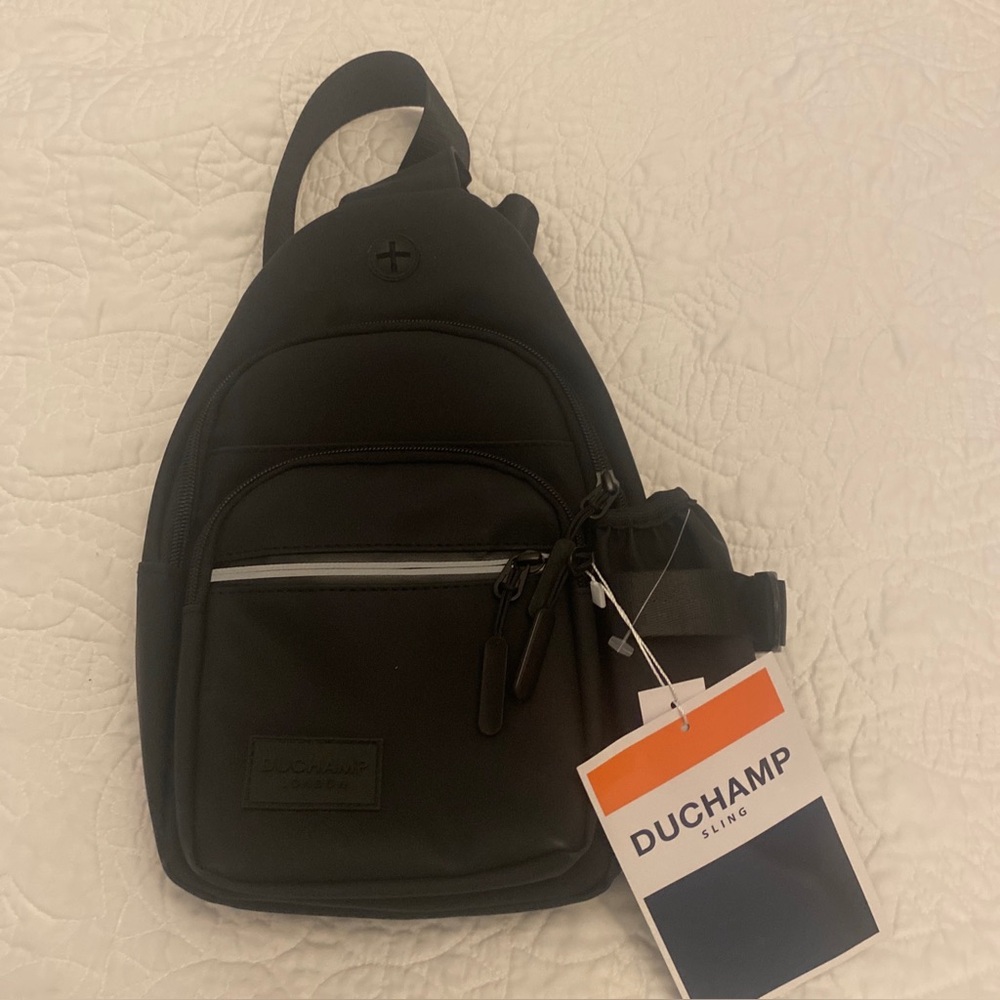 Duchamp London men’s sling bag. New with tags. Black classic!